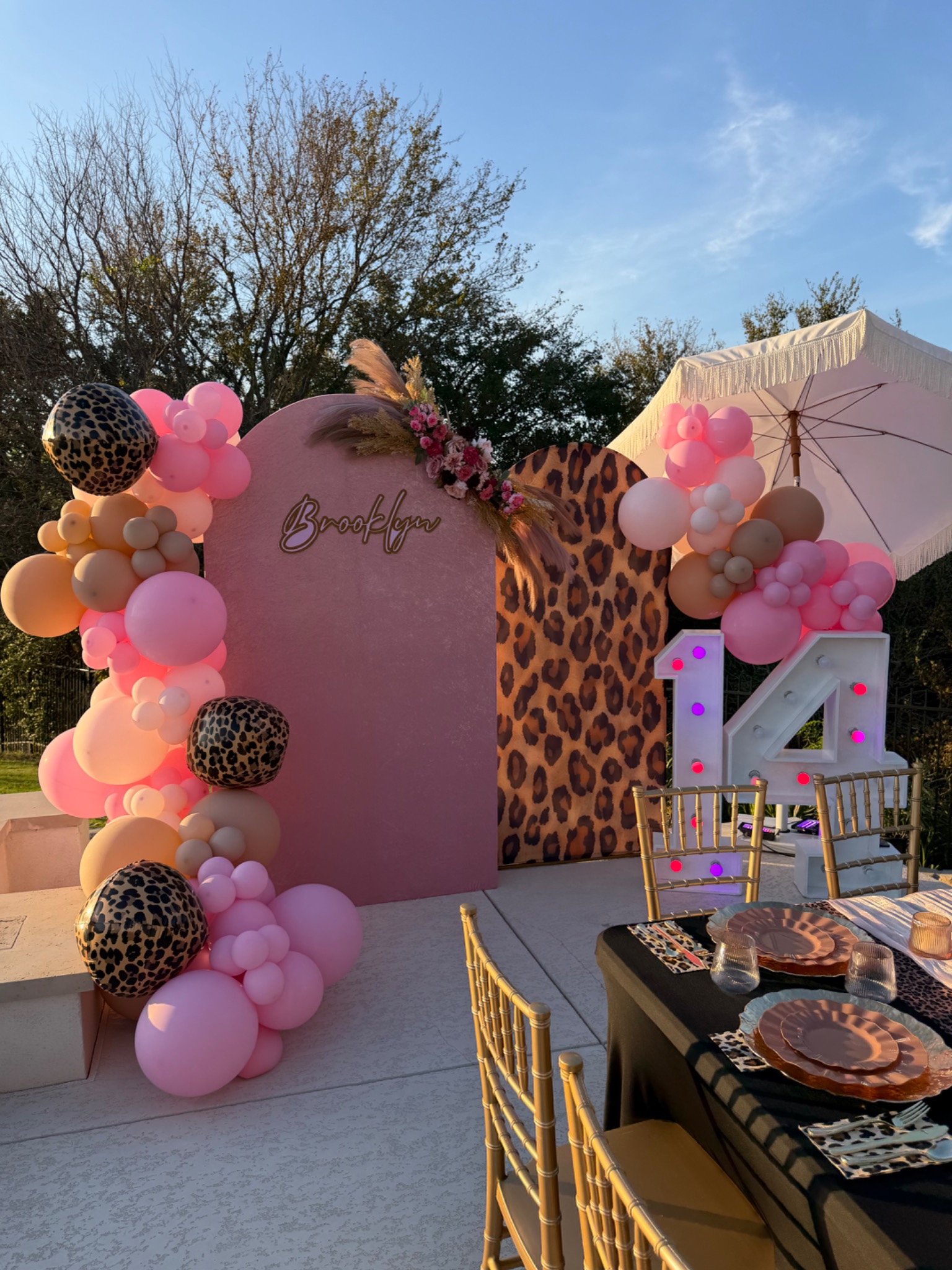 Pink, neutral and leopard-print birthday balloon backdrop