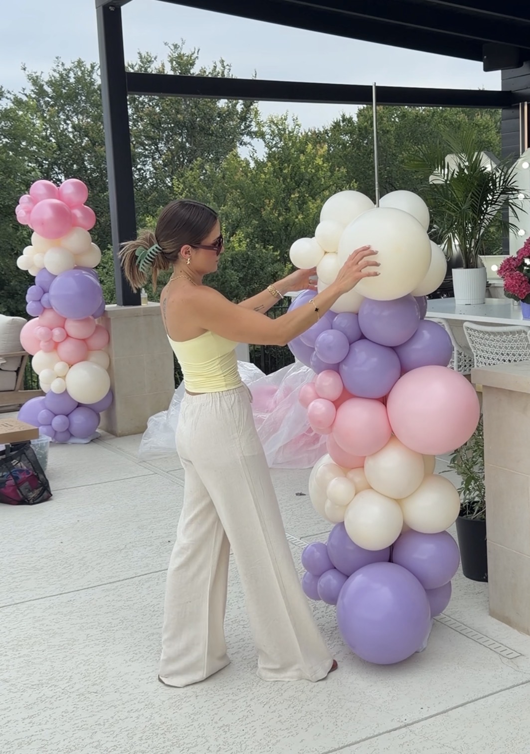 Aline building pastel pink, lavender and cream balloon columns